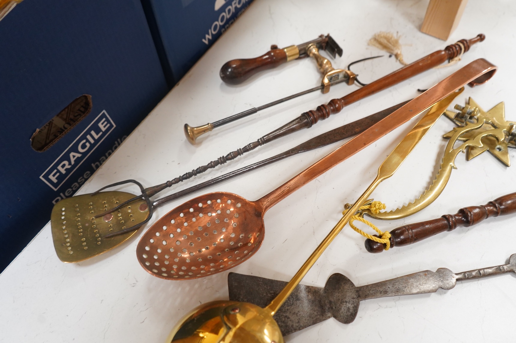 A 19th century toasting fork - longest 59cms, strainer spoons, etc